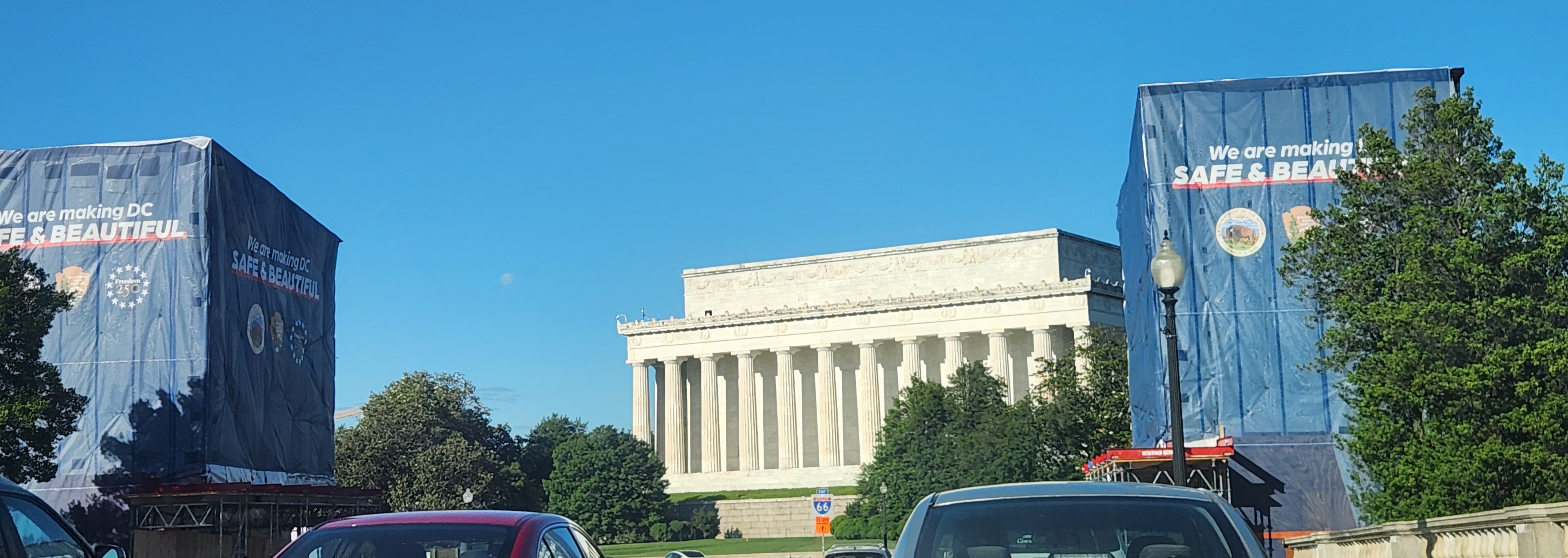 construction banners covering the bronze statues on the Arlington Memorial Bridge